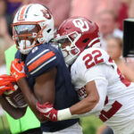 Auburn and Oklahoma play football.