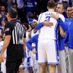 Duke's Jon Scheyer and Cooper Flagg hug after a win over Alabama.