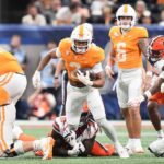 Tennessee RB Peyton Lewis runs the ball.