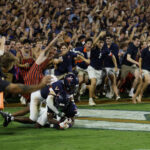 Virginia fans rushed the field after beating Florida State.