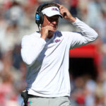 Lane Kiffin coaches during a game.