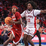 Labaron Philon drives past Ian Jackson.